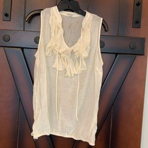 Ivory sleeveless blouse with loose ruffles
